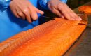 Hand carving smoked salmon